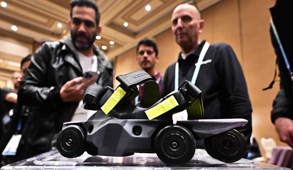 People view the Moonwalker from Shift, the first-ever mobility device that allows one to walk at the speed of a run up to three times faster than walking, during Showstoppers on January 9, 2024 at the Consumer Electronics Show (CES) in Las Vegas, Nevada.