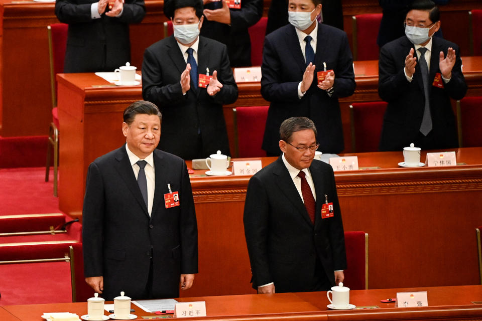 China's President Xi Jinping (L) and Politburo Standing Committee member Li Qiang arrive for the fourth plenary session of the National People's Congress (NPC) at the Great Hall of the People in Beijing on March 11, 2023. (Photo by GREG BAKER / POOL / AFP) (Photo by GREG BAKER/POOL/AFP via Getty Images)