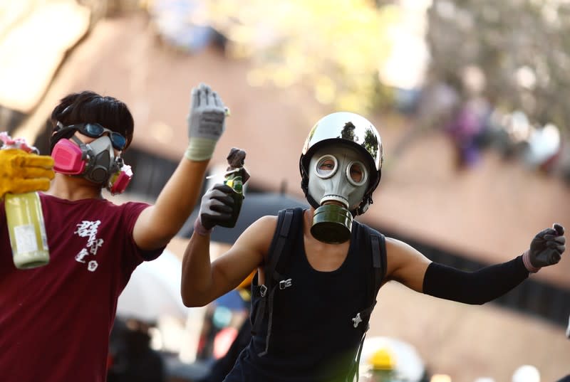 Protesters clash with police outside Hong Kong Polytechnic University (PolyU) in Hong Kong