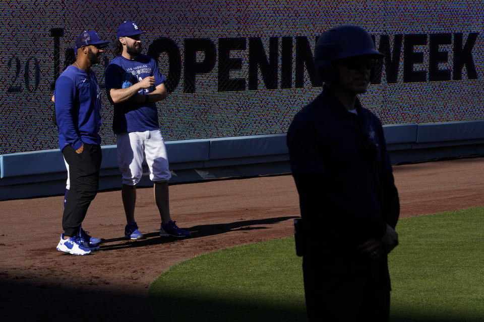 Los Angeles Dodgers warm up before a baseball game against the Cincinnati Reds in Los Angeles, Thursday, April 14, 2022. (AP Photo/Ashley Landis)