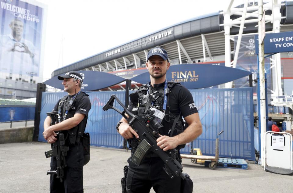 <p>Armed police on patrol prior to the Champions League soccer final at the National Stadium, Cardiff, Wales, Saturday June 3, 2017 </p>