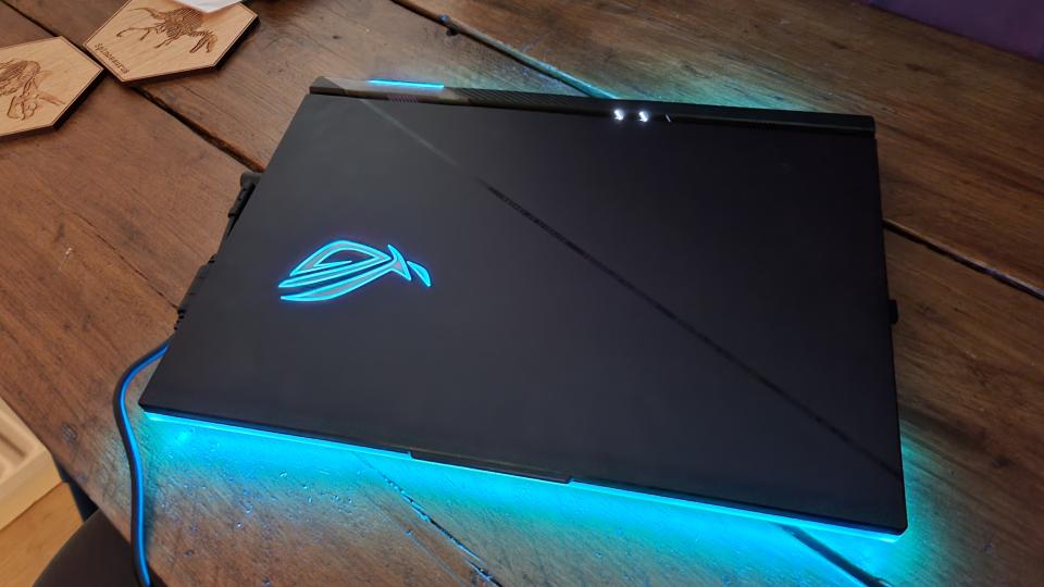 The Asus ROG Strix Scar 18 with its lid closed, showing off the huge amounts of RGB lighting