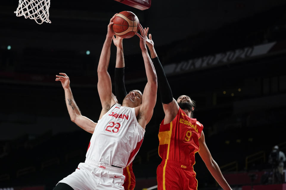 Japan's Gavin Earl Edwards (23) grabs a rebound from Spain's Ricky Rubio (9) during a men's basketball preliminary round game at the 2020 Summer Olympics in Saitama, Japan, Monday, July 26, 2021. (AP Photo/Charlie Neibergall)