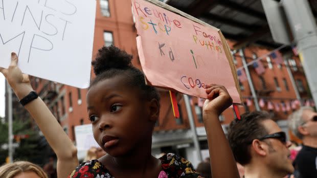 A child holds a sign during a rally in New York.