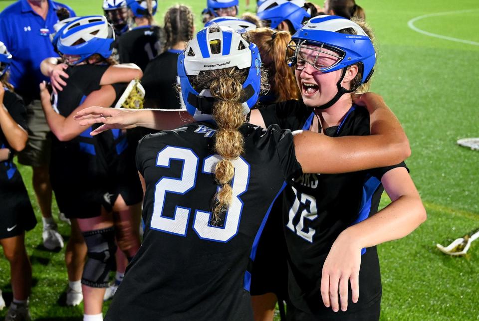 Izzy Difato (23) celebrates with teammates after Bartram Trail's Class 2A victory against Vero Beach.