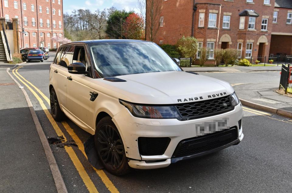 A damaged white Range Rover after reports of a crash with parked cars in the Dickens Heath area of Solihull Photo: PA