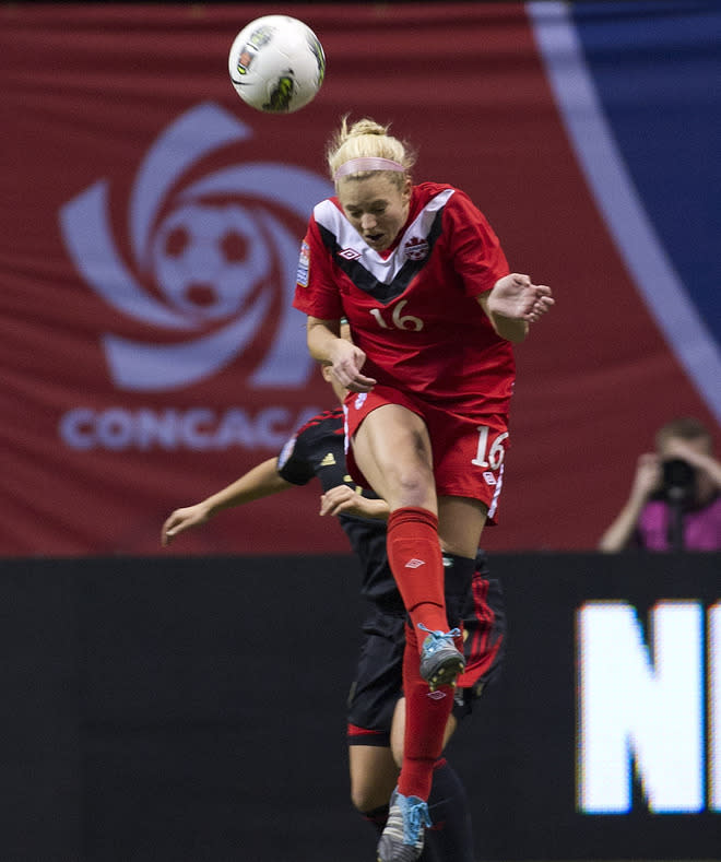VANCOUVER, CANADA - JANUARY 27: Lauren Sesselmann #16 of Canada out jumps Teresa Novola #7 of Mexico for the loose ball during the first half of semifinals action of the 2012 CONCACAF Women's Olympic Qualifying Tournament at BC Place on January 27, 2012 in Vancouver, British Columbia, Canada. (Photo by Rich Lam/Getty Images)