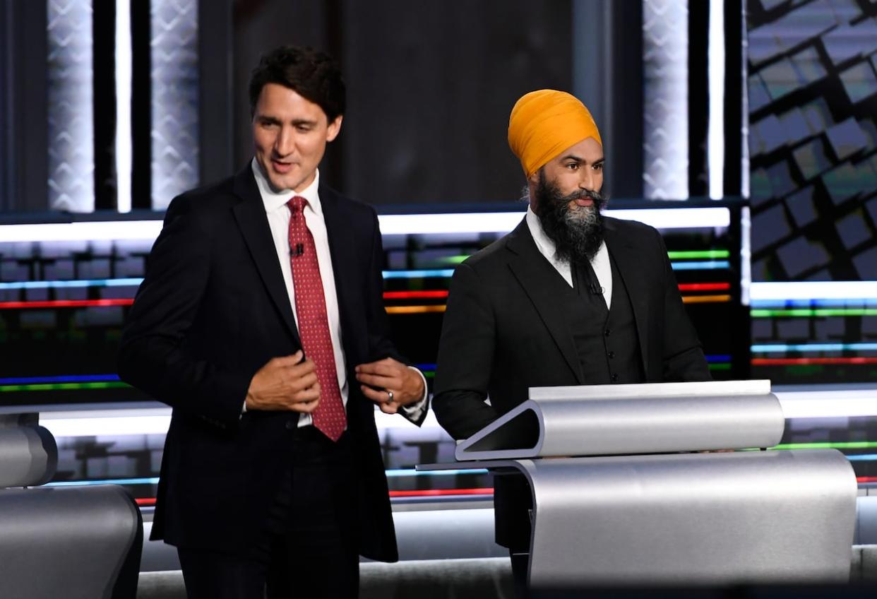 Liberal Leader Justin Trudeau, left, and NDP Leader Jagmeet Singh prepare for the start of the federal election English-language leaders debate in Gatineau, Que., on Thursday, Sept. 9, 2021. (Justin Tang/The Canadian Press - image credit)