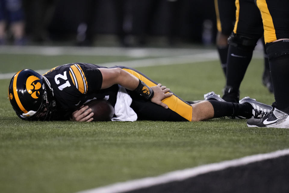 Iowa quarterback Cade McNamara (12) lies injured on the field during the first half of an NCAA college football game against Michigan State, Saturday, Sept. 30, 2023, in Iowa City, Iowa. (AP Photo/Charlie Neibergall)