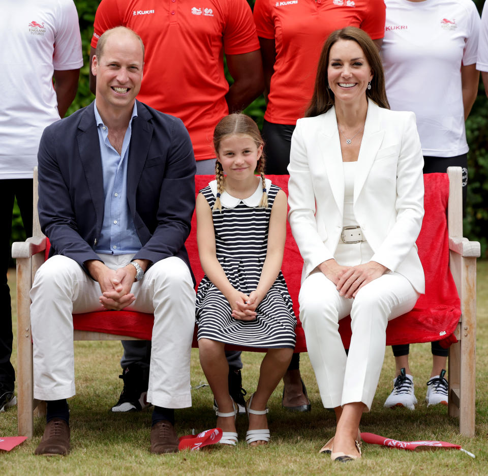 BIRMINGHAM, ENGLAND - AUGUST 02: Prince William, Duke of Cambridge, Catherine, Duchess of Cambridge and Princess Charlotte of Cambridge pose for a photograph as they visit Sportsid House at the 2022 Commonwealth Games on August 02, 2022 in Birmingham, England. The Duchess became the Patron of SportsAid in 2013, Team England Futures programme is a partnership between SportsAid, Sport England and Commonwealth Games England which will see around 1,000 talented young athletes and aspiring support staff given the opportunity to attend the Games and take a first-hand look behind-the-scenes. (Photo by Chris Jackson/Getty Images)