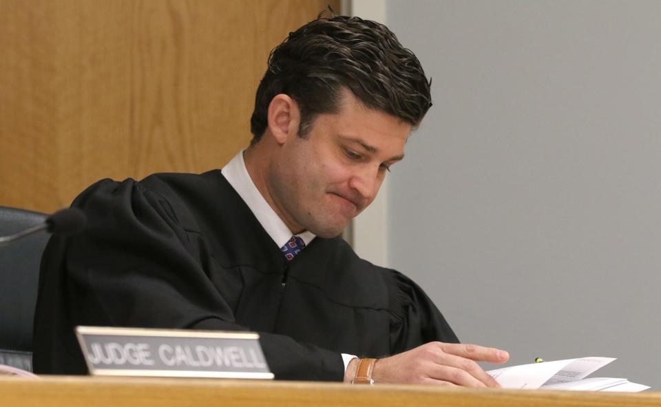 Superior Court Judge Jesse Caldwell looks over documents in the plea hearing on May 9, 2022, at the Gaston County Courthouse.