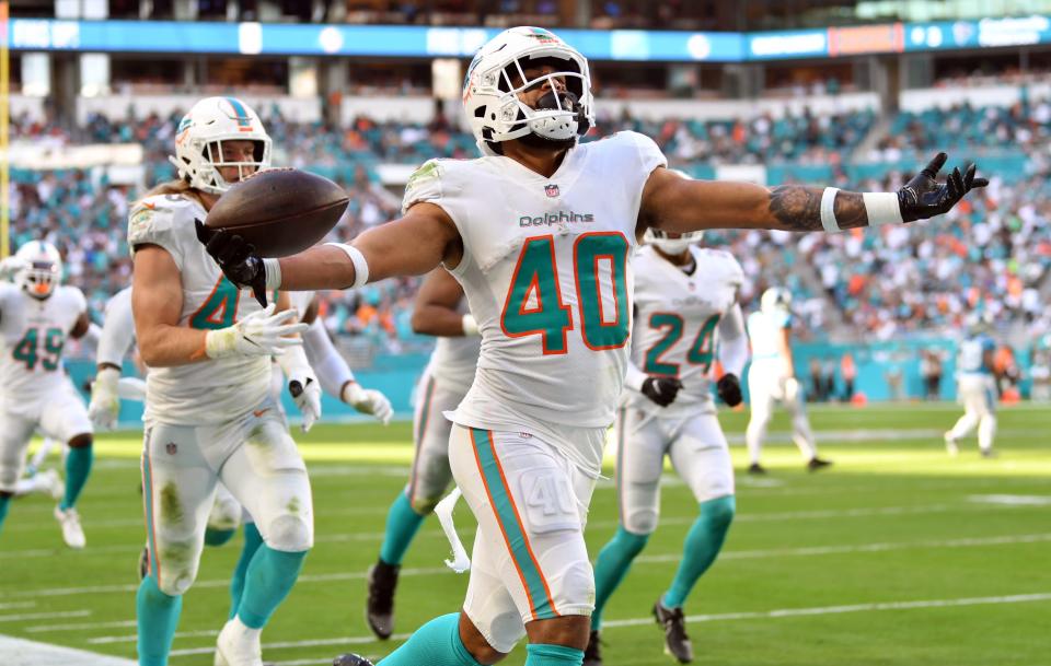 Miami Dolphins free safety Nik Needham (40) celebrates an interception against the Carolina Panthers during fourth quarter of an NFL game at Hard Rock Stadium in Miami Gardens, Nov. 28, 2021. 