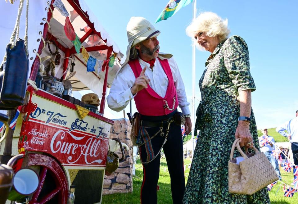 The Duchess of Cornwall meets a re-enactor during a tour of the festival (Finnbarr Webster/PA) (PA Wire)