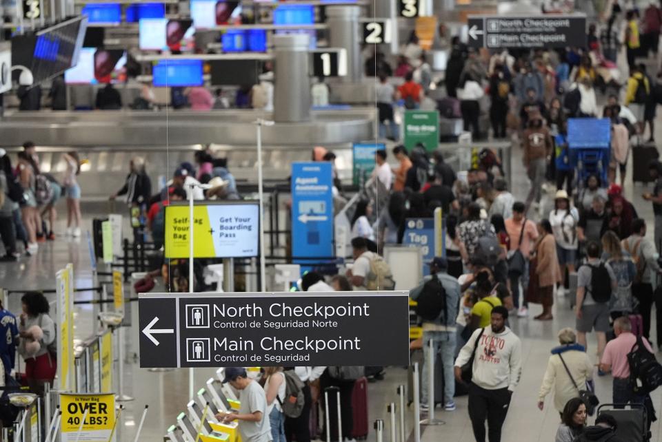 Travelers move through Hartsfield-Jackson Atlanta International Airport ahead of Memorial Day, Friday, May 24, 2024, in Atlanta.(AP Photo/Mike Stewart)