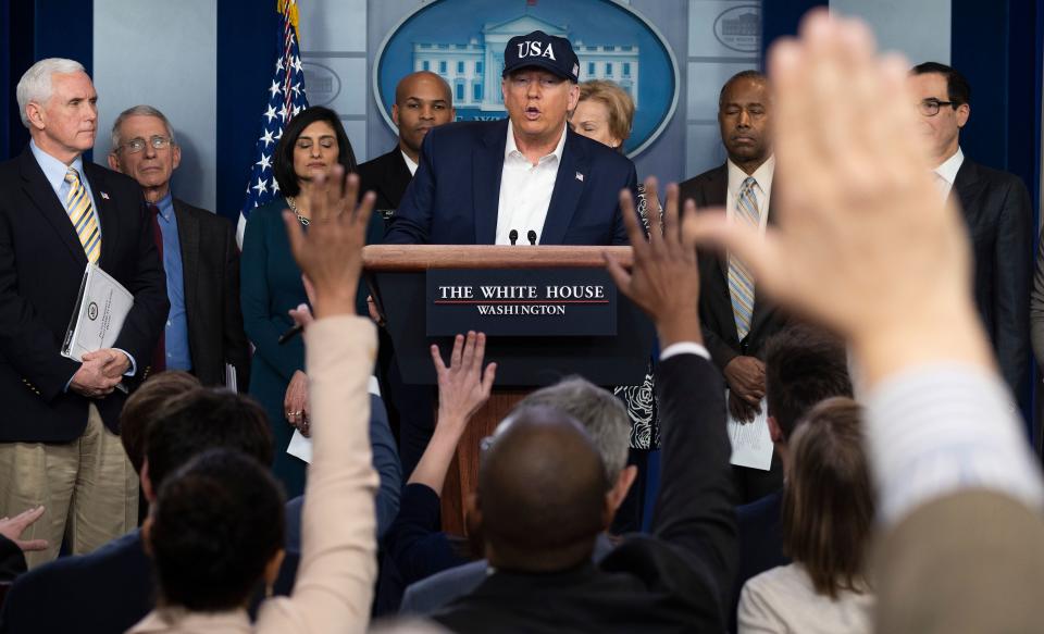 President Trump at a press briefing about the coronavirus pandemic alongside members of the coronavirus task force on Saturday. (Jim Watson/AFP via Getty Images)