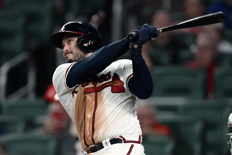 Atlanta Braves' Travis d'Arnaud watches his three-run home run in the sixth inning of the team's baseball game against the New York Mets on Monday, Aug. 15, 2022, in Atlanta. (AP Photo/John Bazemore)