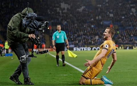 Tottenham Hotspur's English striker Harry Kane celebrates in front of a TV camera - Credit:  ADRIAN DENNIS/AFP