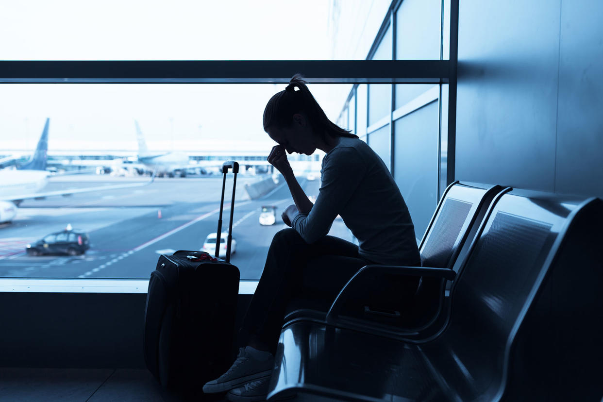 Stressed woman in the airport Getty Images/kieferpix