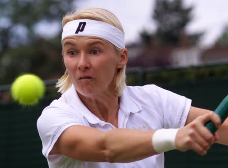 FILE PHOTO - Jana Novotna of the Czech Republic plays a return to France's Nathalie Dechy during their fourth round match at the Wimbledon Tennis Championships June 28. Novotna is seed number five in the competition./File Photo