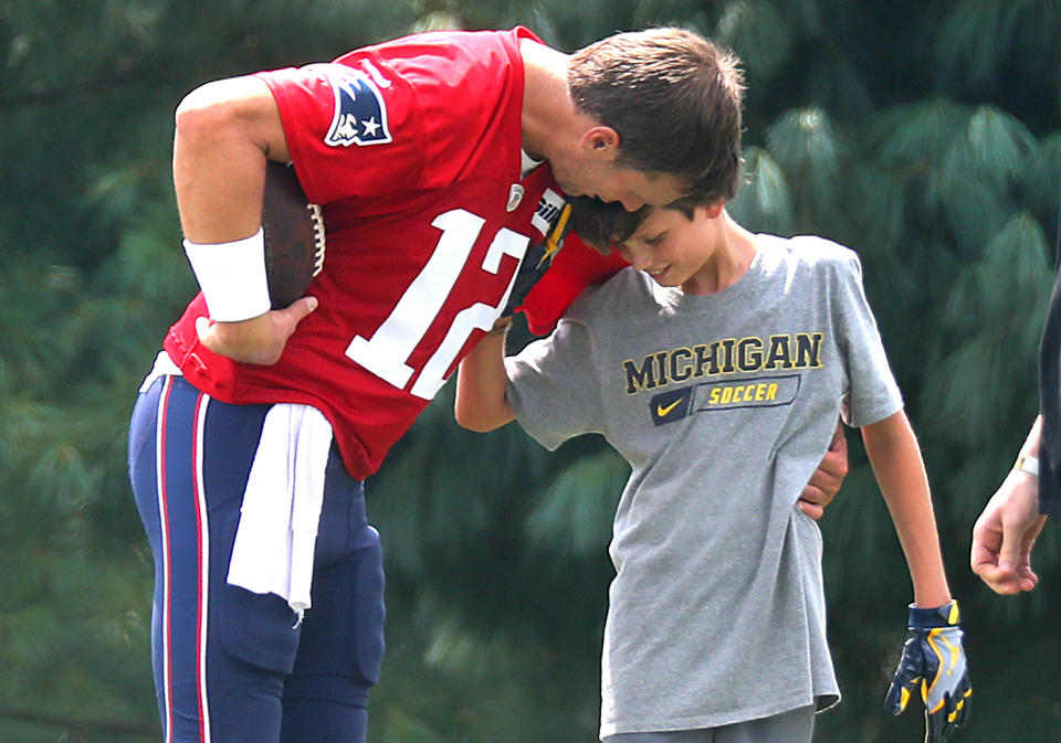 Tom Brady with his oldest son, Jack, as he was throwing him some passes after New England Patriots training camp in 2018. (John Tlumacki / Boston Globe via Getty Images)