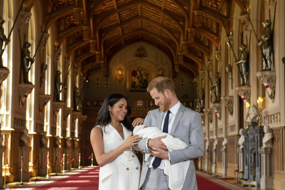 Britain's Prince Harry and Meghan, Duchess of Sussex, during a photocall with their newborn son, in St George's Hall at Windsor Castle, Windsor, south England, Wednesday May 8, 2019. Baby Sussex was born Monday at 5:26 a.m. (0426 GMT; 12:26 a.m. EDT) at an as-yet-undisclosed location. An overjoyed Harry said he and Meghan are "thinking" about names. (Dominic Lipinski/Pool via AP)