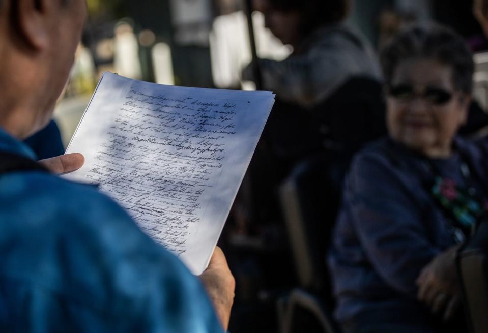 Darrell Kunitomi reads from a letter his uncle wrote in 1942.