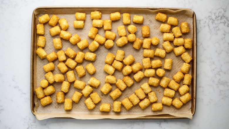 baked tater tots on baking sheet