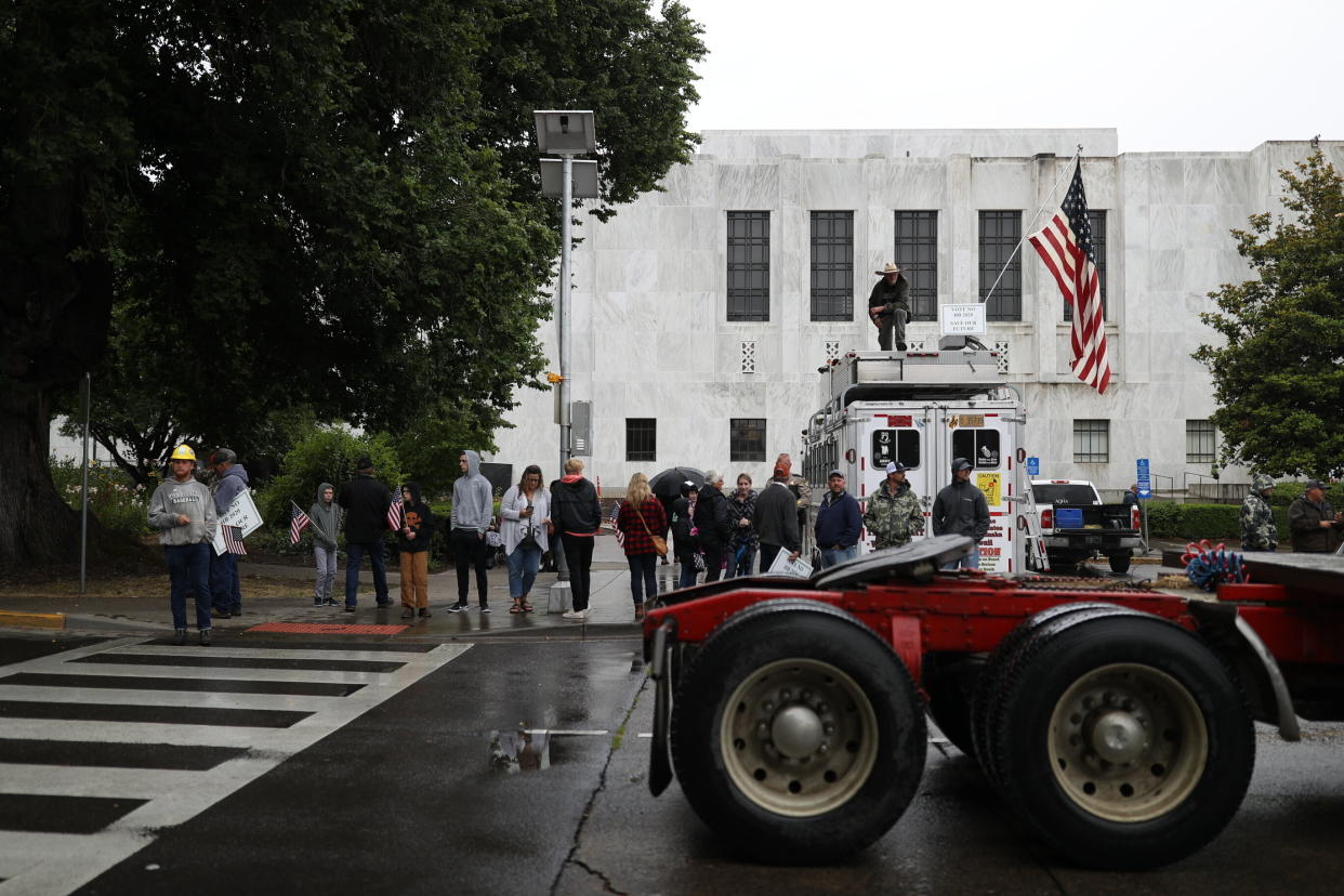 Truckers and loggers opposed to the carbon capping bill hold a rally at the Oregon Capitol on Thursday morning. (Photo: ASSOCIATED PRESS)