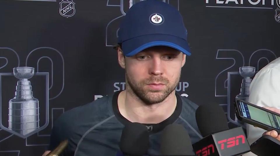 A dejected Josh Morrissey speaks to reporters after Tuesday night's playoff-ending loss to the Colorado Avalanche.  (Winnipeg Jets - image credit)