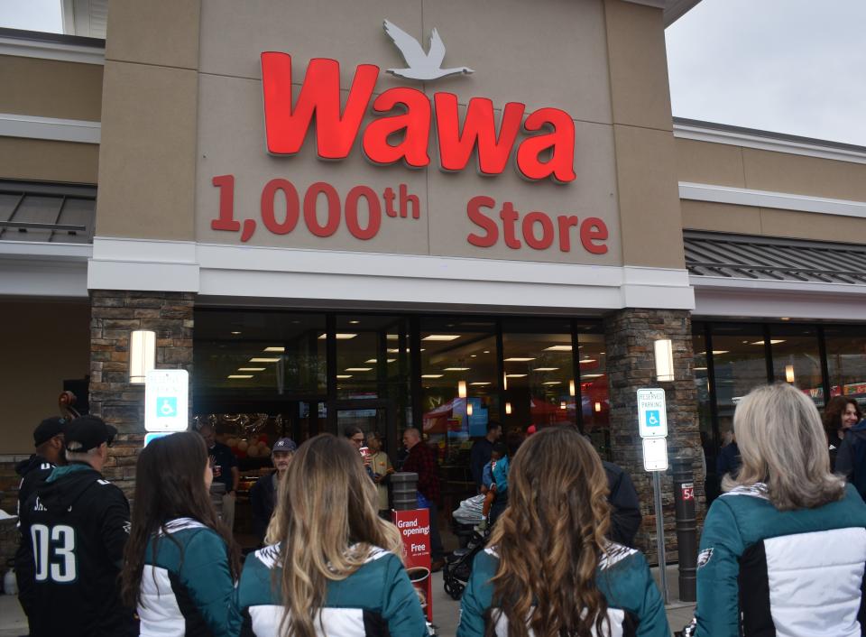 Philadelphia Eagles cheerleaders look on at the grand opening of Wawa's 1,000th store on White Horse Pike in Oaklyn.