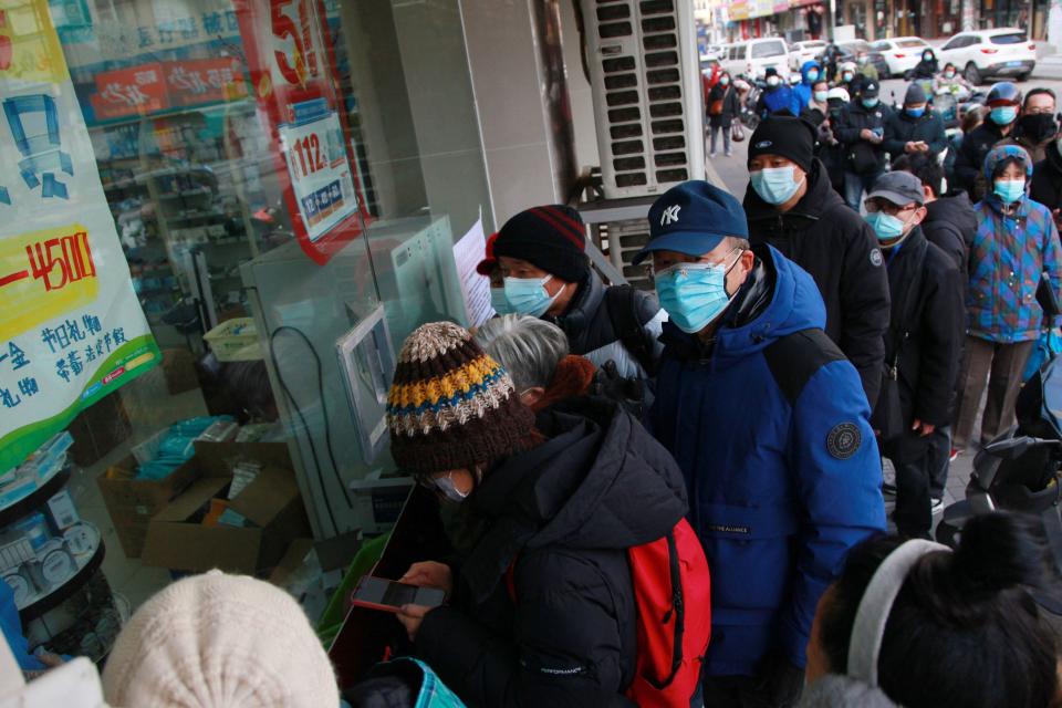 People queue to buy medicine at a pharmacy amid the Covid-19 pandemic in Nanjing, in China's eastern Jiangsu province on December 20, 2022. - China OUT (Photo by AFP) / China OUT (Photo by STR/AFP via Getty Images)