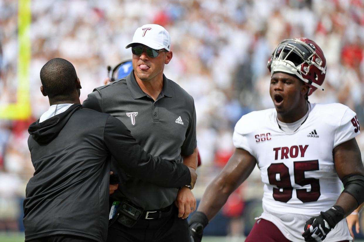 Troy head coach Jon Sumrall reacts after a play during the first half an NCAA college football game against Mississippi in Oxford, Miss., Saturday, Sept. 3, 2022. (AP Photo/Thomas Graning)