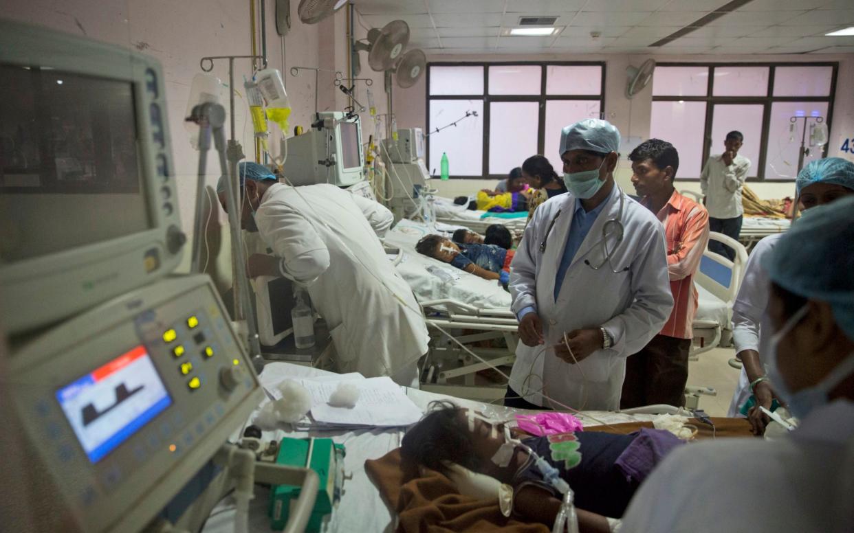 Children are treated at Baba Raghav Das Medical College Hospital in Gorakhpur, in the northern Indian state of Uttar Pradesh - AP