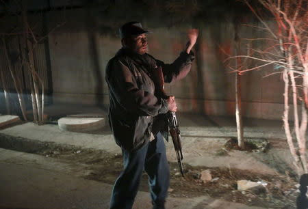 An Afghan policeman keeps watch at the site of an explosion in Kabul, Afghanistan January 1, 2016. REUTERS/Omar Sobhani