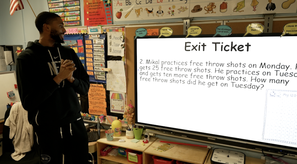 Bridges instructing first grade math, reading a basketball word problem to students. / Credit: CBS News