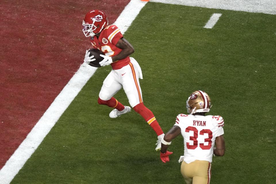 Mecole Hardman Jr. scores a touchdown in the Kansas City Chiefs' victory over the San Francisco 49ers in Super Bowl LVI.  (AP Photo/Charlie Riddell)