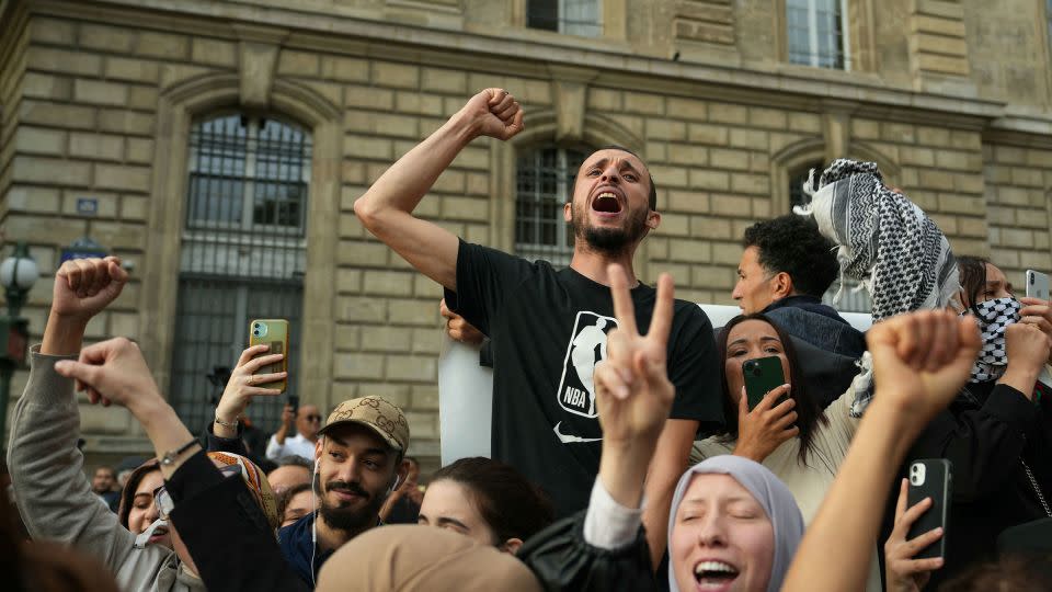 Protestors chant as they gather at Place de la Republique on October 12, 2023.  - Dimitar Dilkoff/AFP/Getty Images