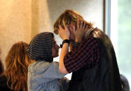 <p>A young woman comforts a crying man outside the courtroom after Jeremy Christian was arraigned in Portland, Ore, Tuesday, May 30, 2017. (AP Photo/Don Ryan) </p>