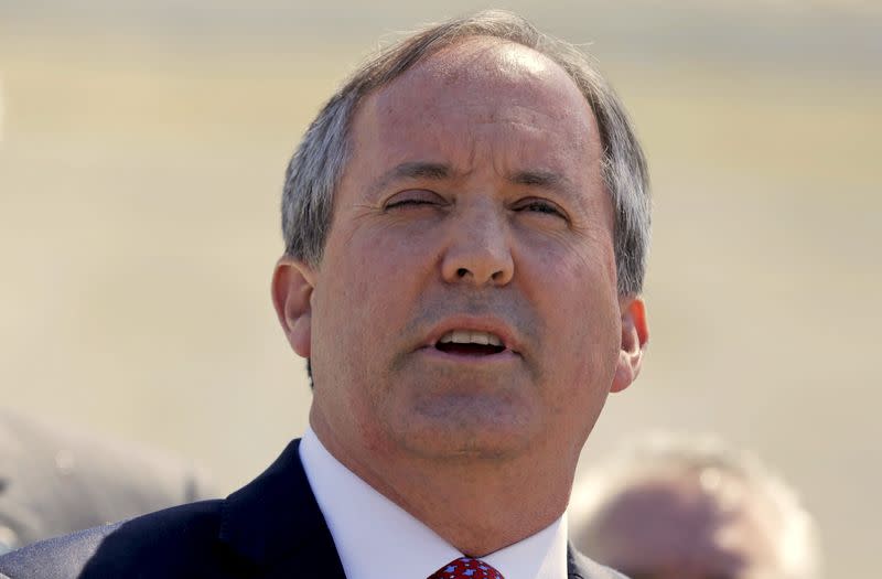 FILE PHOTO: Texas Attorney General Paxton speaks outside the U.S. Supreme Court after justices heard arguments over the constitutionality of President Obama's executive action to defer deportation of certain immigrants, in Washington