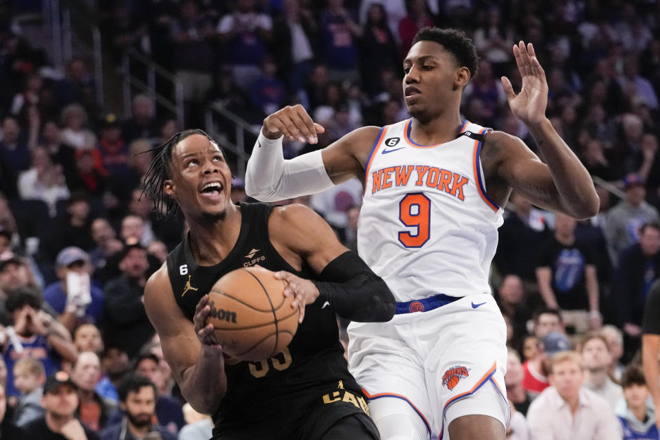 Cleveland Cavaliers forward Isaac Okoro drives against New York Knicks guard RJ Barrett (9) in the first half of Game 4 in an NBA basketball first-round playoff series, Sunday, April 23, 2023, at Madison Square Garden in New York. (AP Photo/Mary Altaffer)