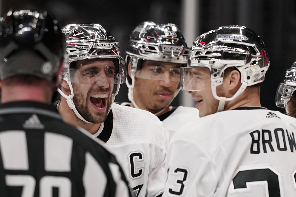 Los Angeles Kings center Anze Kopitar, second from left, celebrates his goal with right wing Dustin Brown, right, during the second period of an NHL hockey game Colorado Avalanche Thursday, Jan. 20, 2022, in Los Angeles. (AP Photo/Mark J. Terrill)