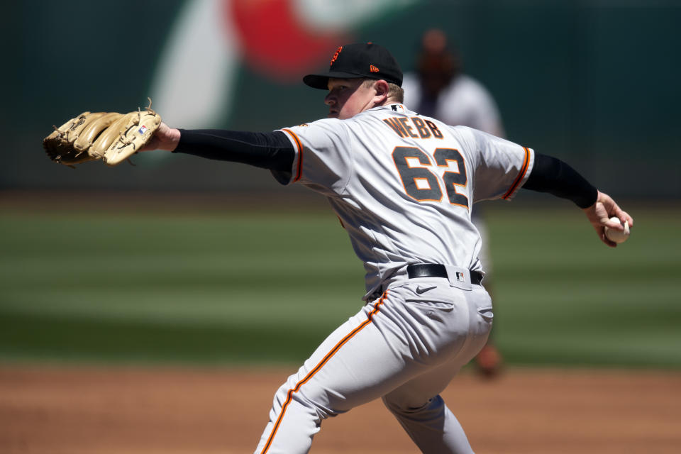 San Francisco Giants starting pitcher Logan Webb (62) delivers against the Oakland Athletics during the second inning of a baseball game, Sunday, Aug. 7, 2022, in Oakland, Calif. (AP Photo/D. Ross Cameron)