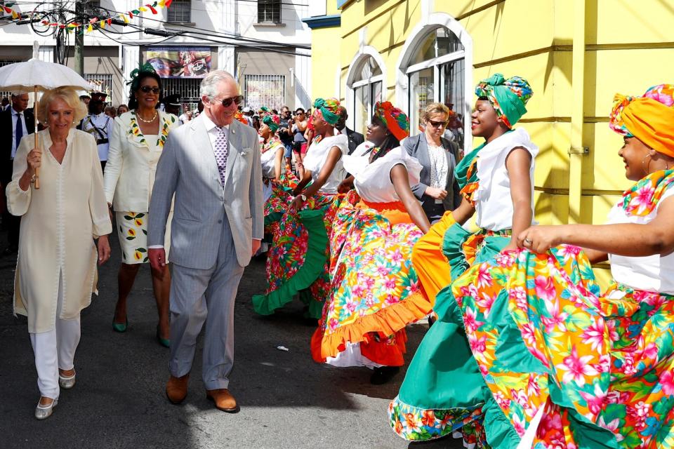 The couple watched dancers perform as they did a walkabout of St George's (REUTERS)