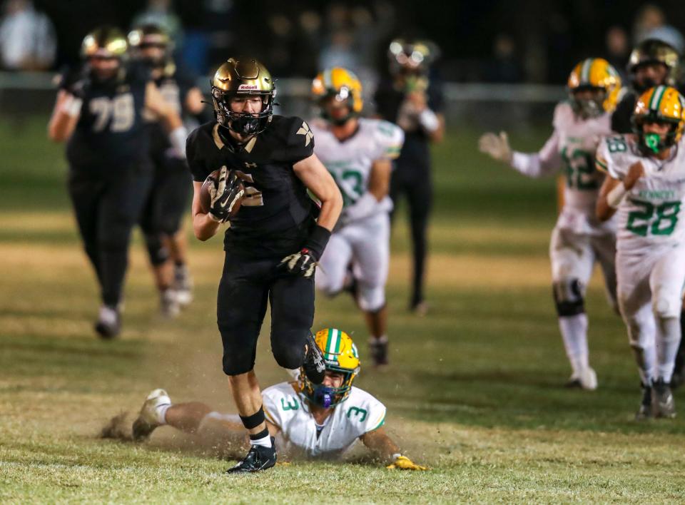 Xavier Prep's Braden Cervello (5) runs after a reception on a scoring play during the fourth quarter of their second-round playoff game at Xavier College Preparatory High School in Palm Desert, Calif., Friday, Nov. 10, 2023.