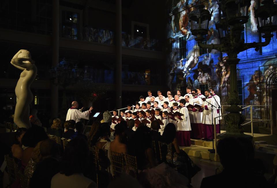 Met Gala attendees watch the Sistine Chapel Choir in 2018.