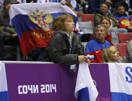 Fans look on during the men's quarter-finals ice hockey game between Russia and Finland at the Sochi 2014 Winter Olympic Games February 19, 2014. REUTERS/Mark Blinch