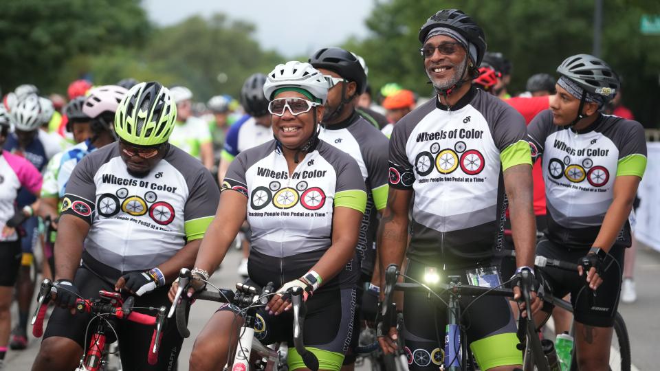 Wheels of Color riders Kelli Johnson, center, and Richard Simon await the start of their group in the 2022 Pelotonia on Saturday in Columbus.