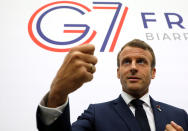 France's President Emmanuel Macron gestures as he speaks to the press after a plenary session at the Bellevue centre in Biarritz, southwestern France, Sunday Aug. 25, 2019. The global economy craves a double shot of confidence right now. The most the leaders of the Group of Seven can offer is likely to be a less intoxicating cocktail: the simple promise not to make things any worse. (Ludovic Marin, Pool via AP)