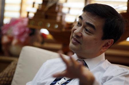 Thailand's opposition leader and former Prime Minister Abhisit Vejjajiva gestures during an interview with foreign media at his Democrat Party headquarters in Bangkok April 23, 2014. AREUTERS/Darren Whiteside