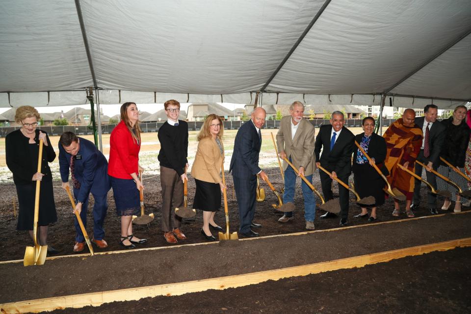 Invited guests turn shovels of dirt at the Fort Worth Texas Temple groundbreaking in Fort Worth, Texas, on Oct. 28, 2023.